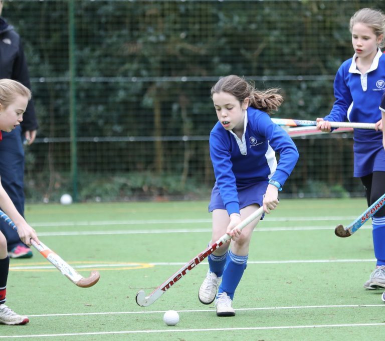 students playing hockey