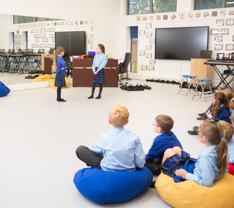 students watching their peers do a presentation