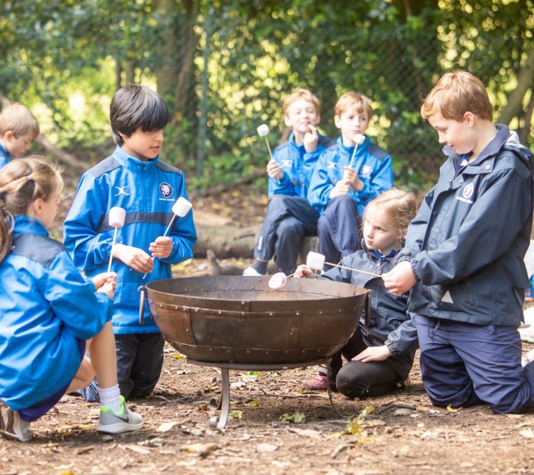 students toasting marshmallows