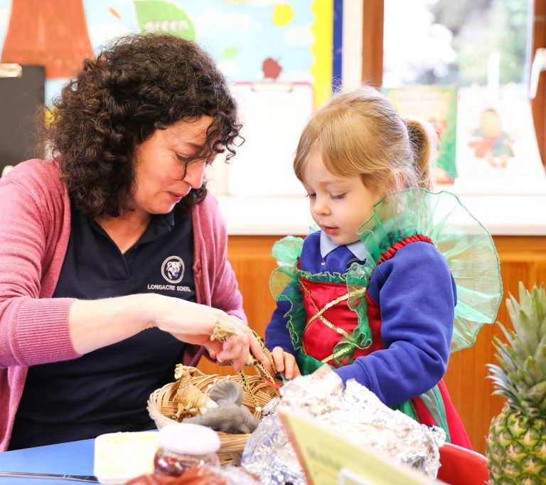 teacher and nursery student