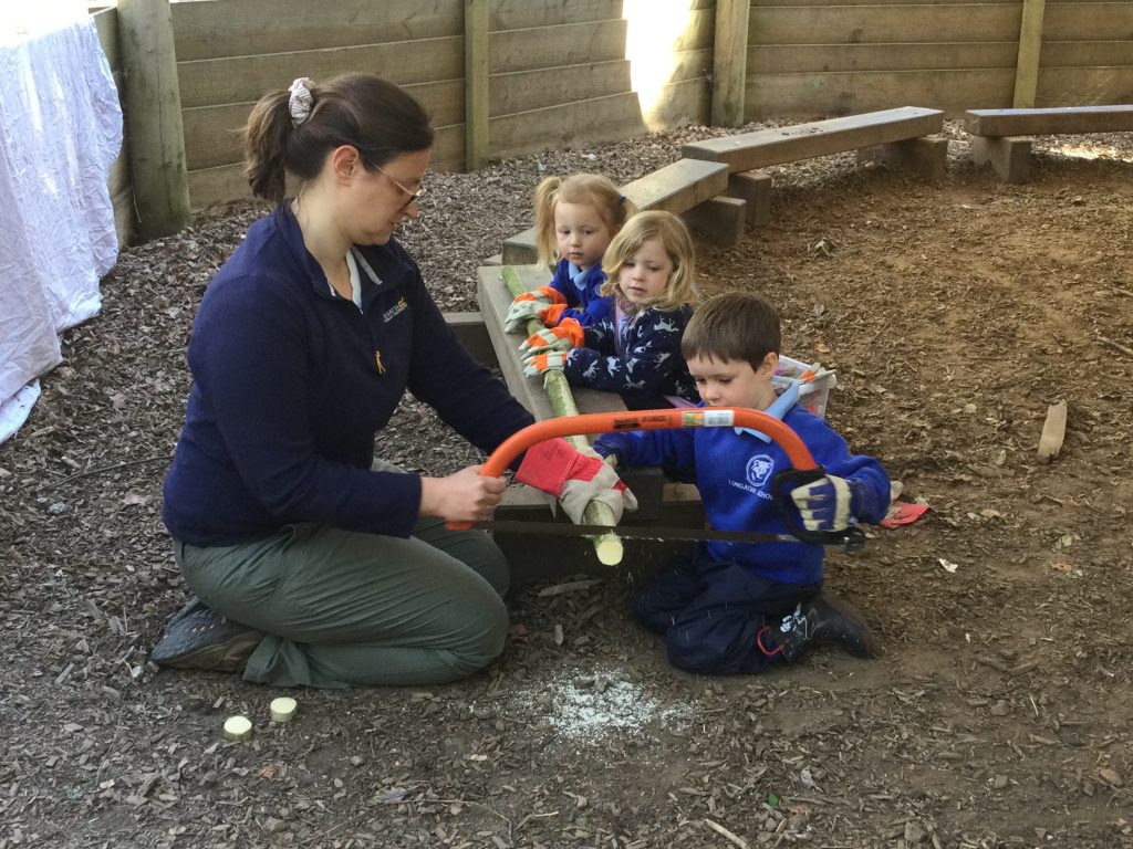 boy using a saw