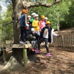 girls and boys in a photo at an obstacle course