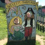 2 kids in a farm park photo still