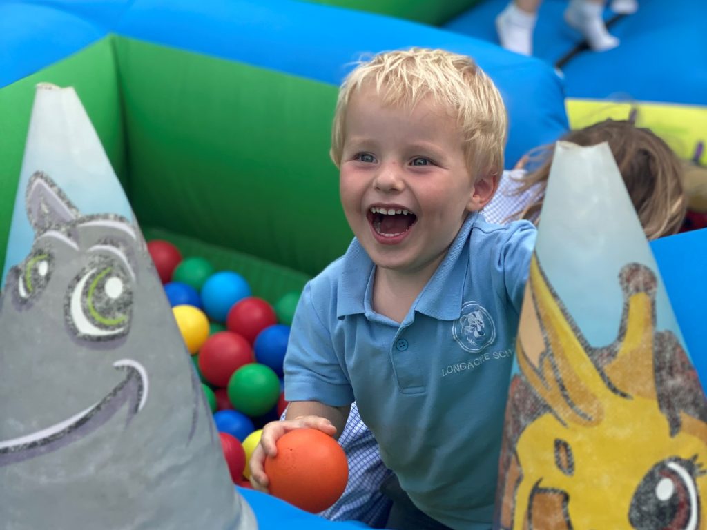 boy in a ball pit