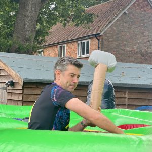 teacher with an inflatable in hand