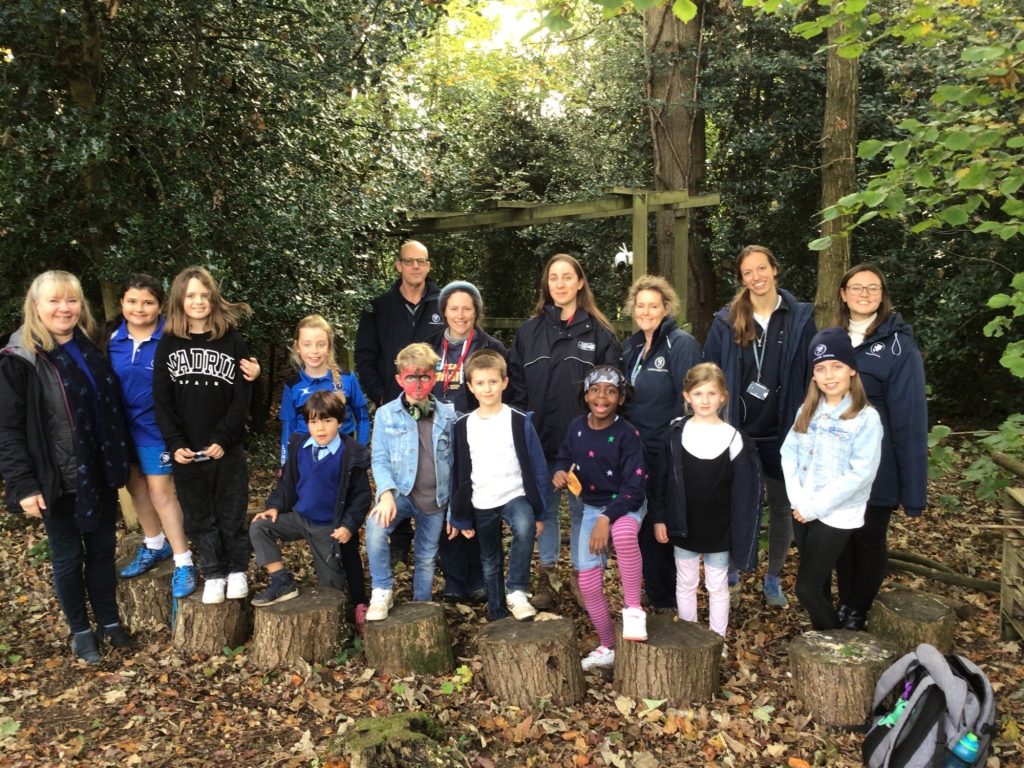 students and teachers in the forest