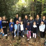 students and teachers in the forest