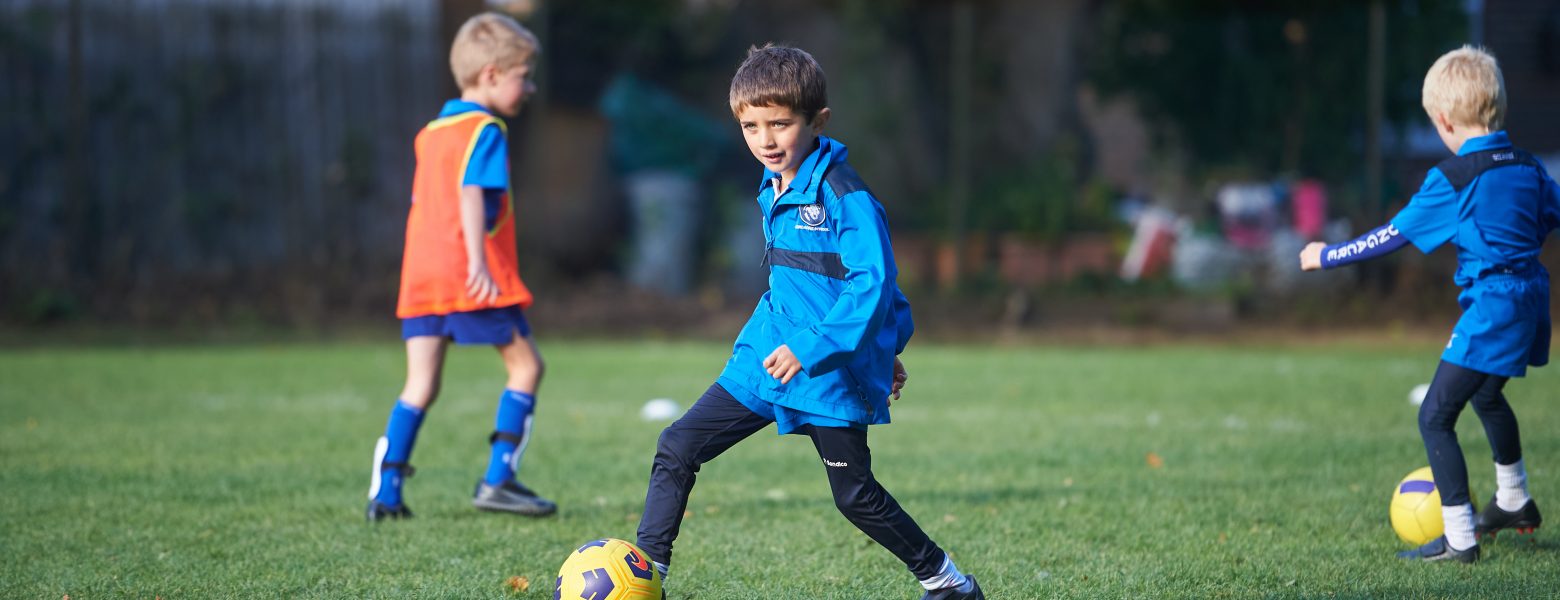 boys playing football outside