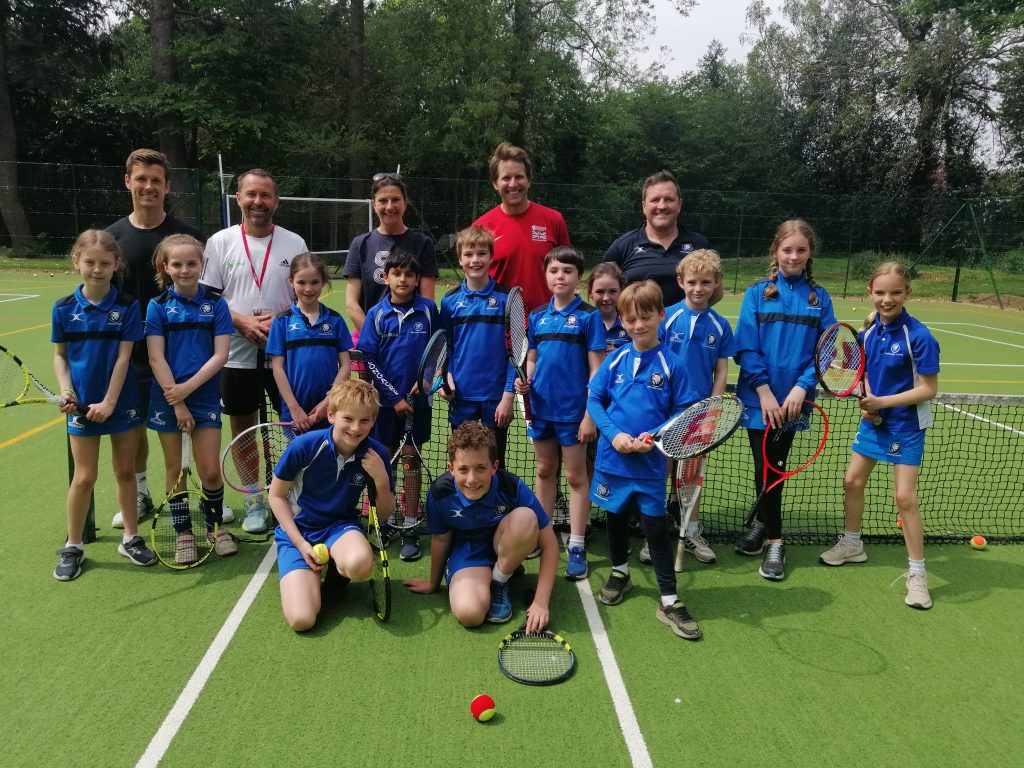 students with tennis players