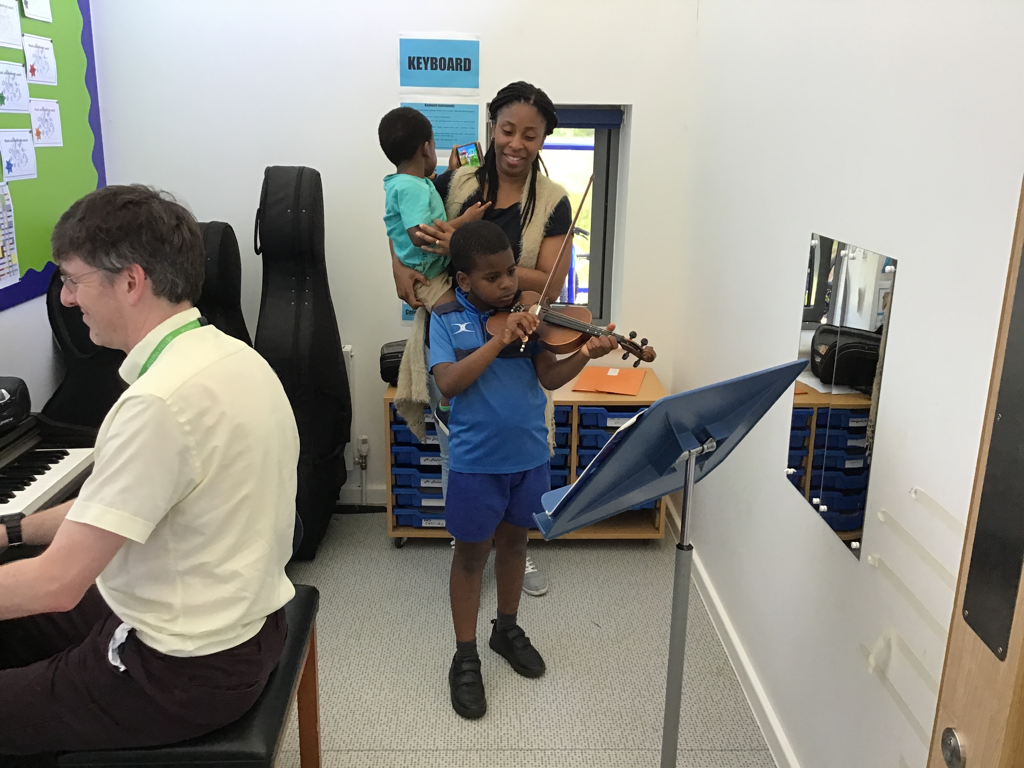 student playing the violin