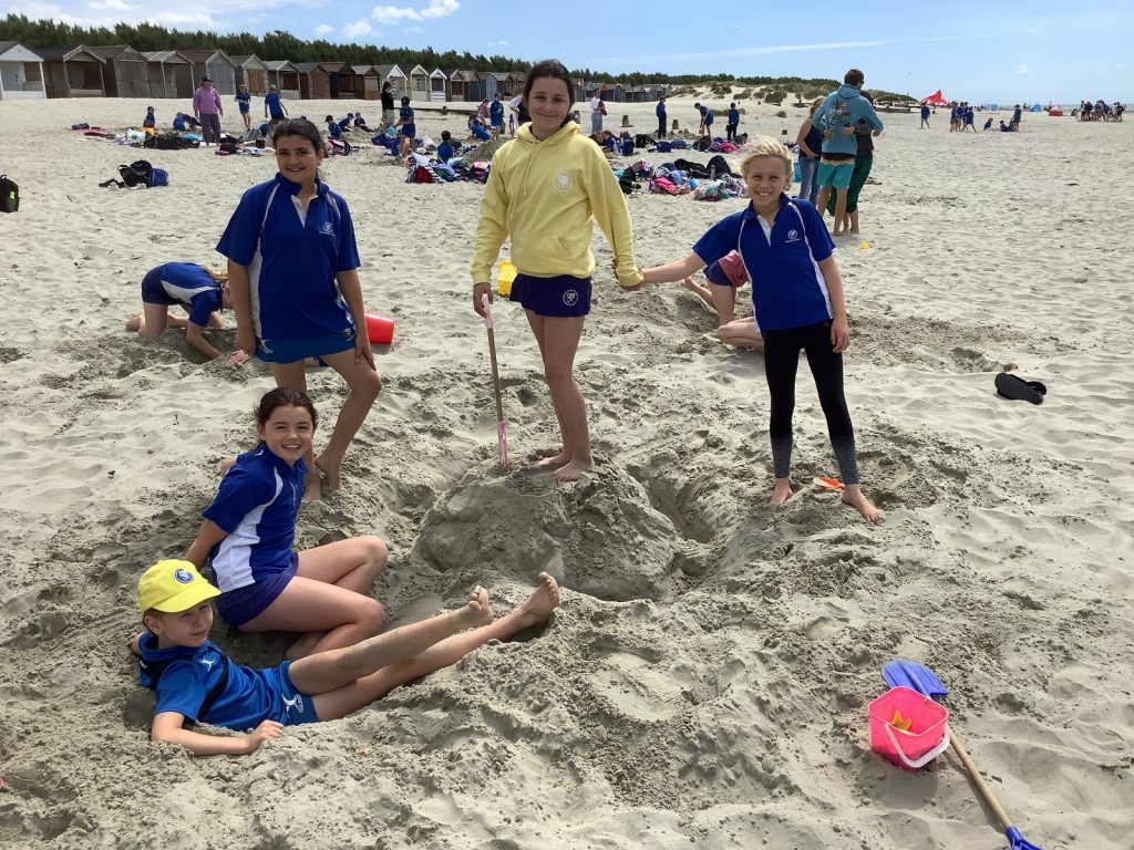 students at the beach