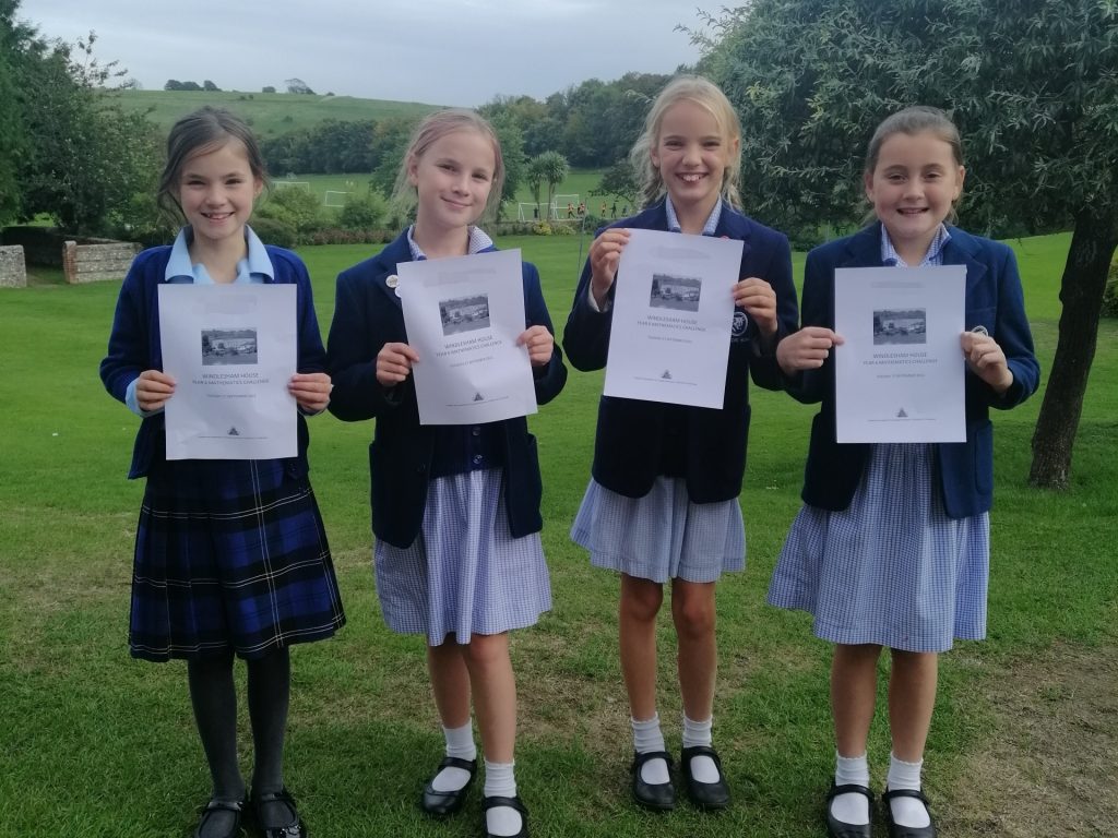 students holding up certificates