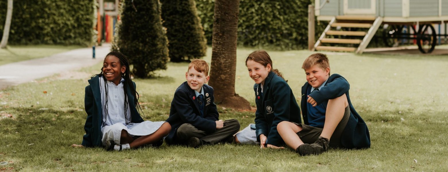 students sat in the gardens