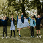 students jumping for a photo